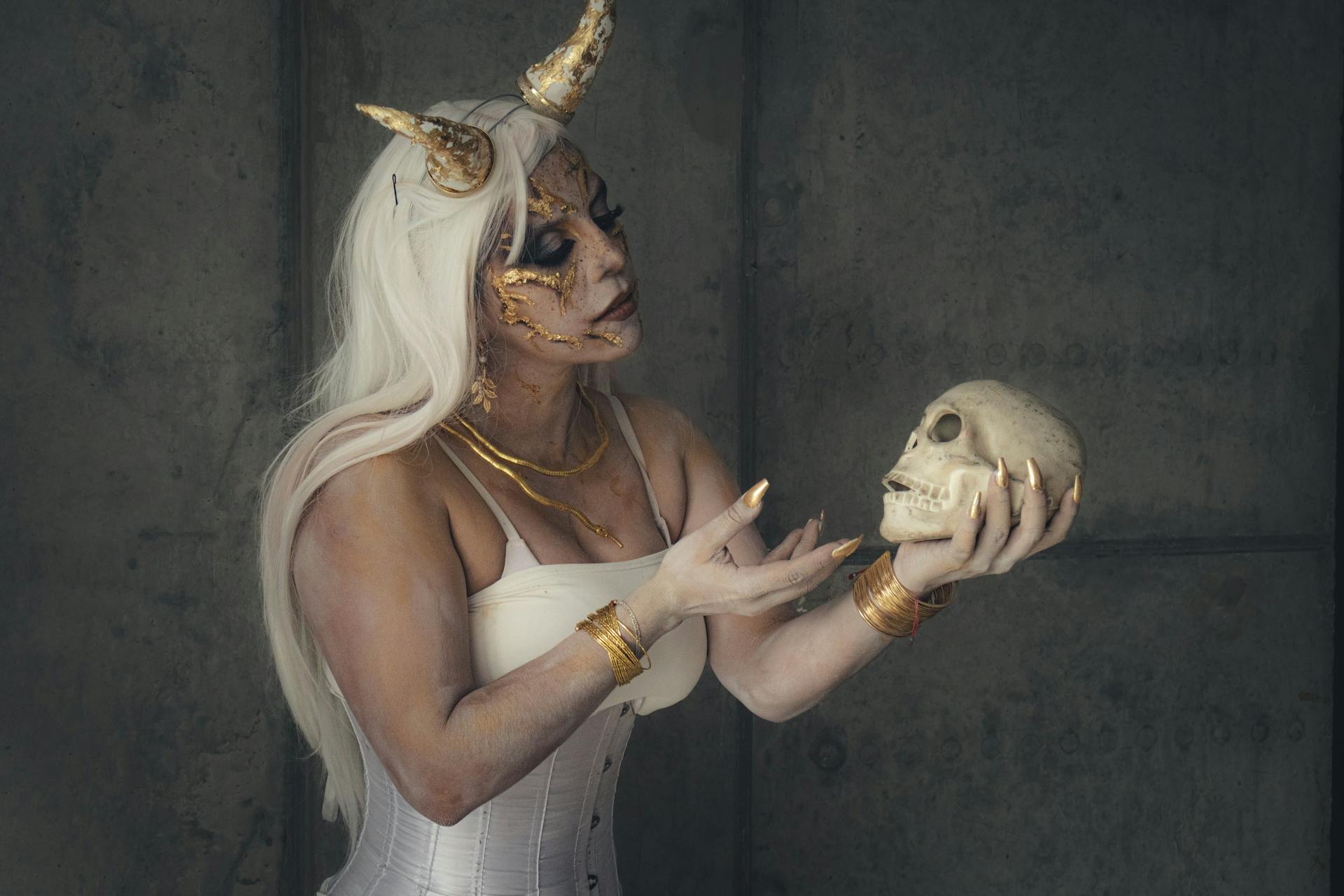 Fantasy Woman with Horns Holding a Skull