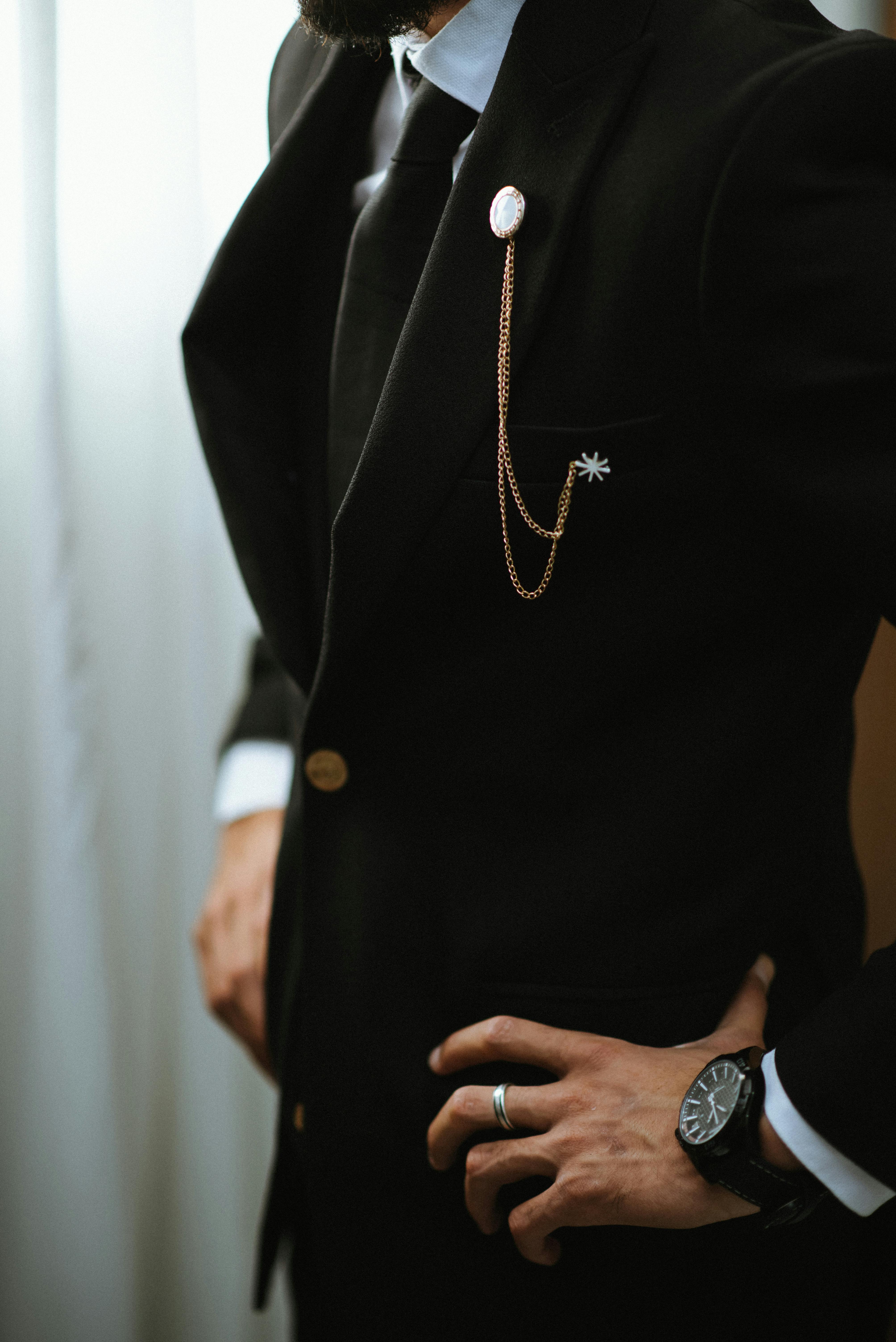 black dress shirt with gold tie