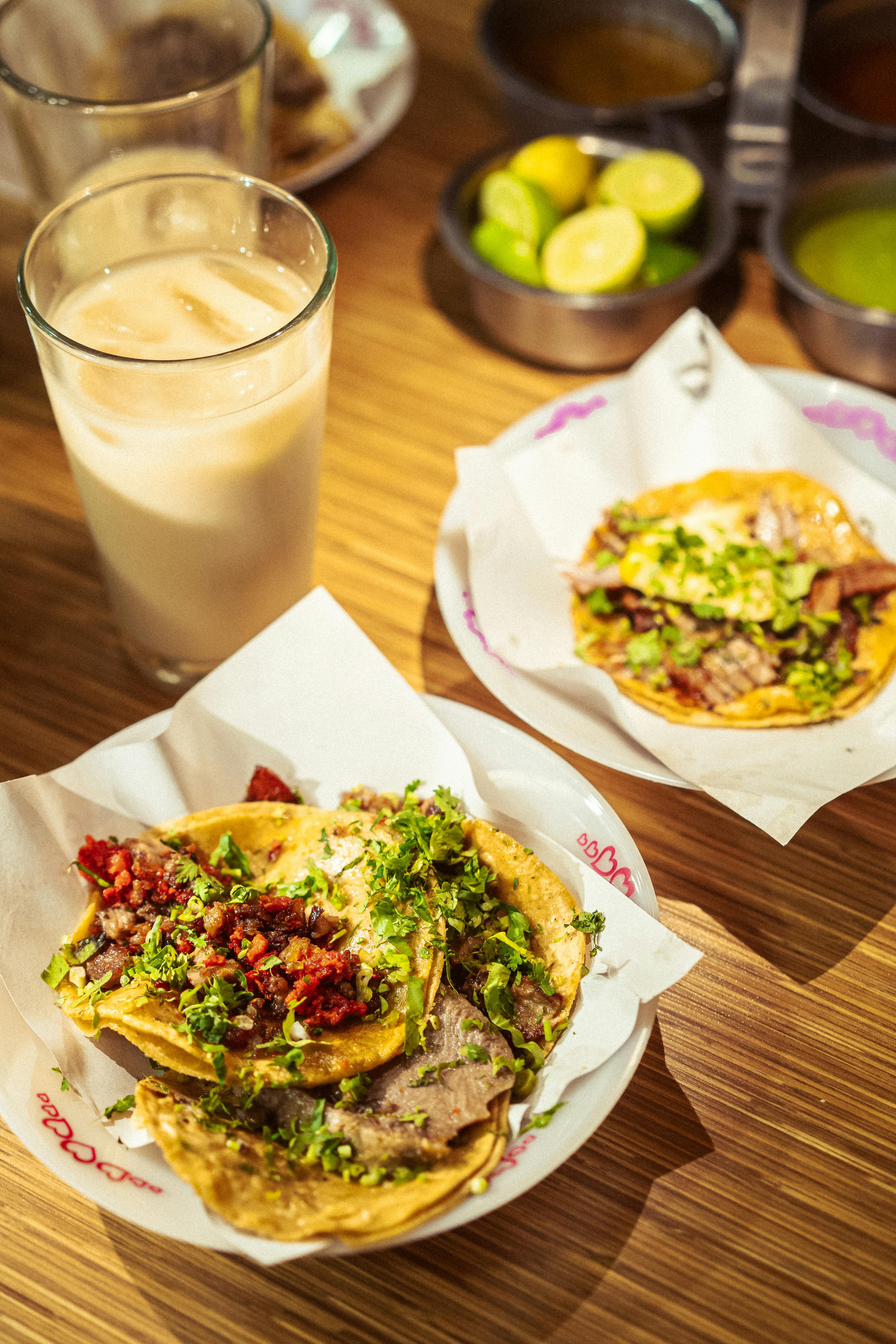 Street food scene featuring tacos and horchata in a cozy restaurant in Mexico City