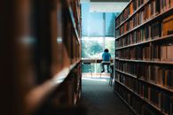 A student studies alone in a serene university library in Vancouver.
