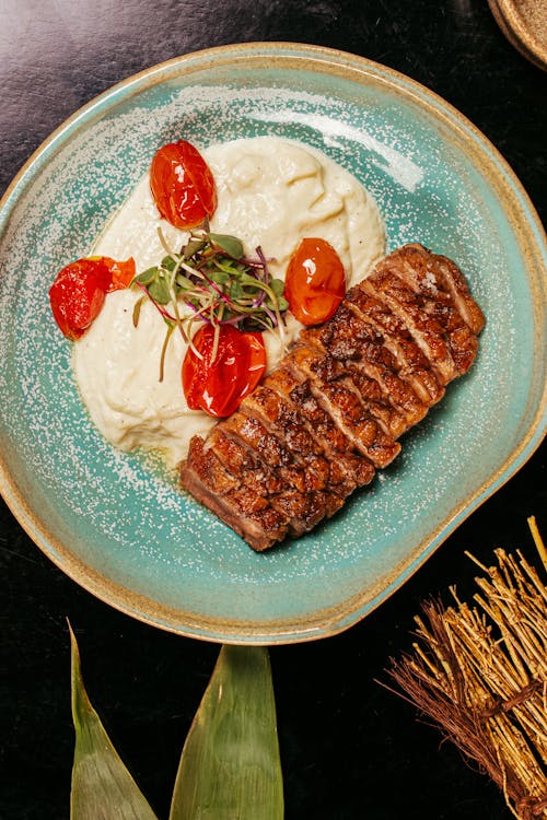 Grilled Steak with Cauliflower Mash and Roasted Tomatoes