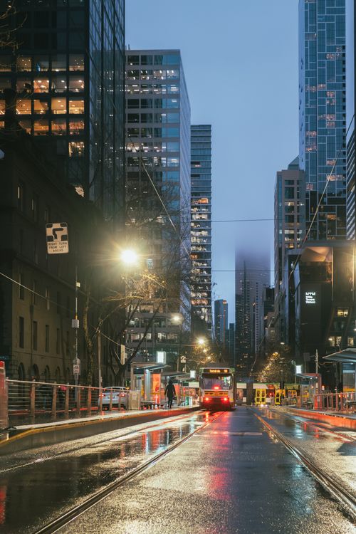Free A rainy evening street scene in Melbourne, Australia with trams and reflections. Stock Photo