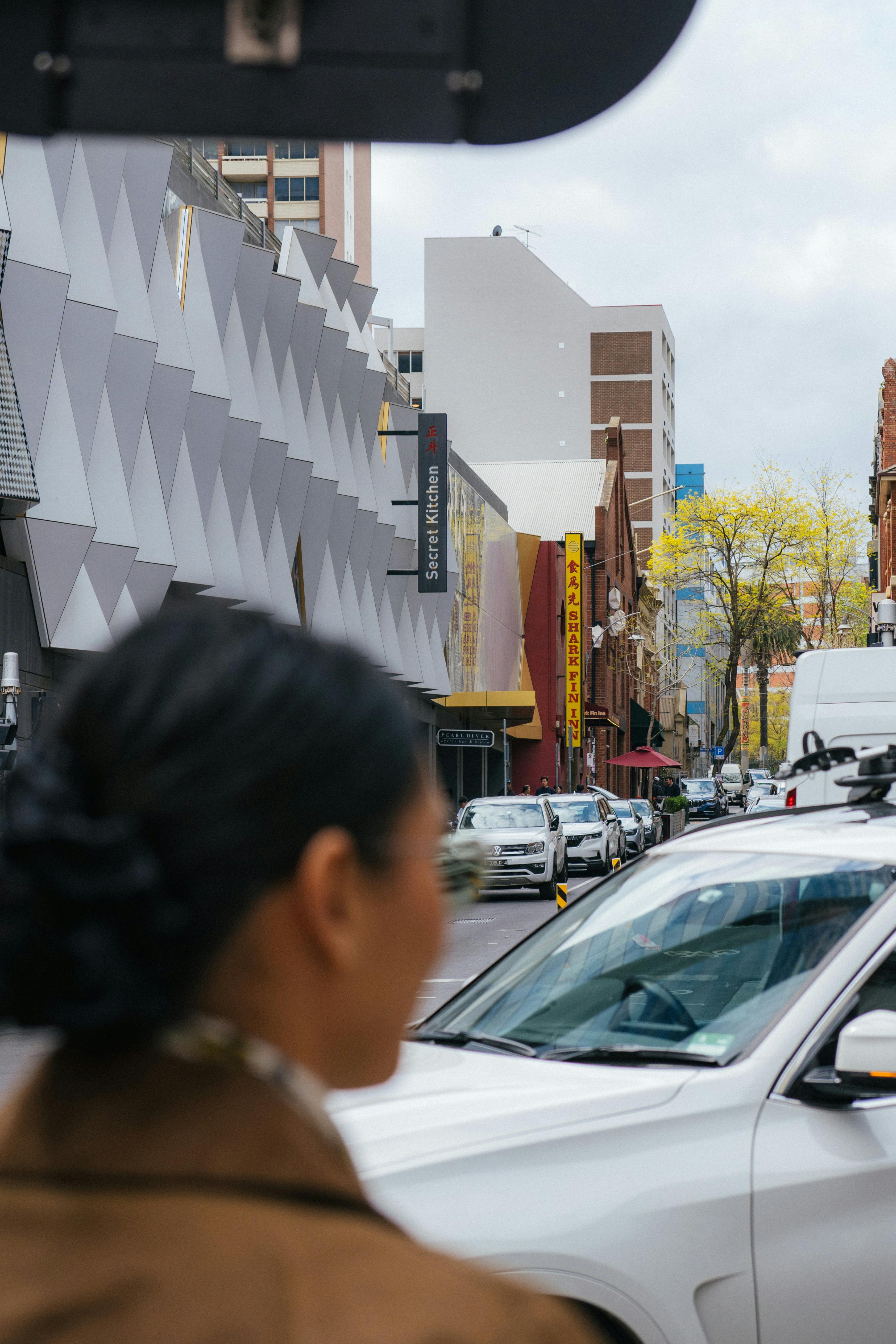 Urban view of vibrant Chinatown in Melbourne, capturing street life and architecture.