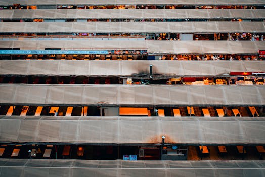 Aerial view of a bustling market in Bangkok showcasing vibrant activity and lively stalls.