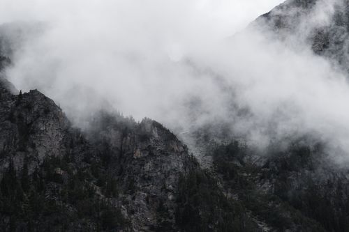 Free Misty and foggy mountain scenery at Mount Currie, BC, Canada showcasing rugged nature. Stock Photo