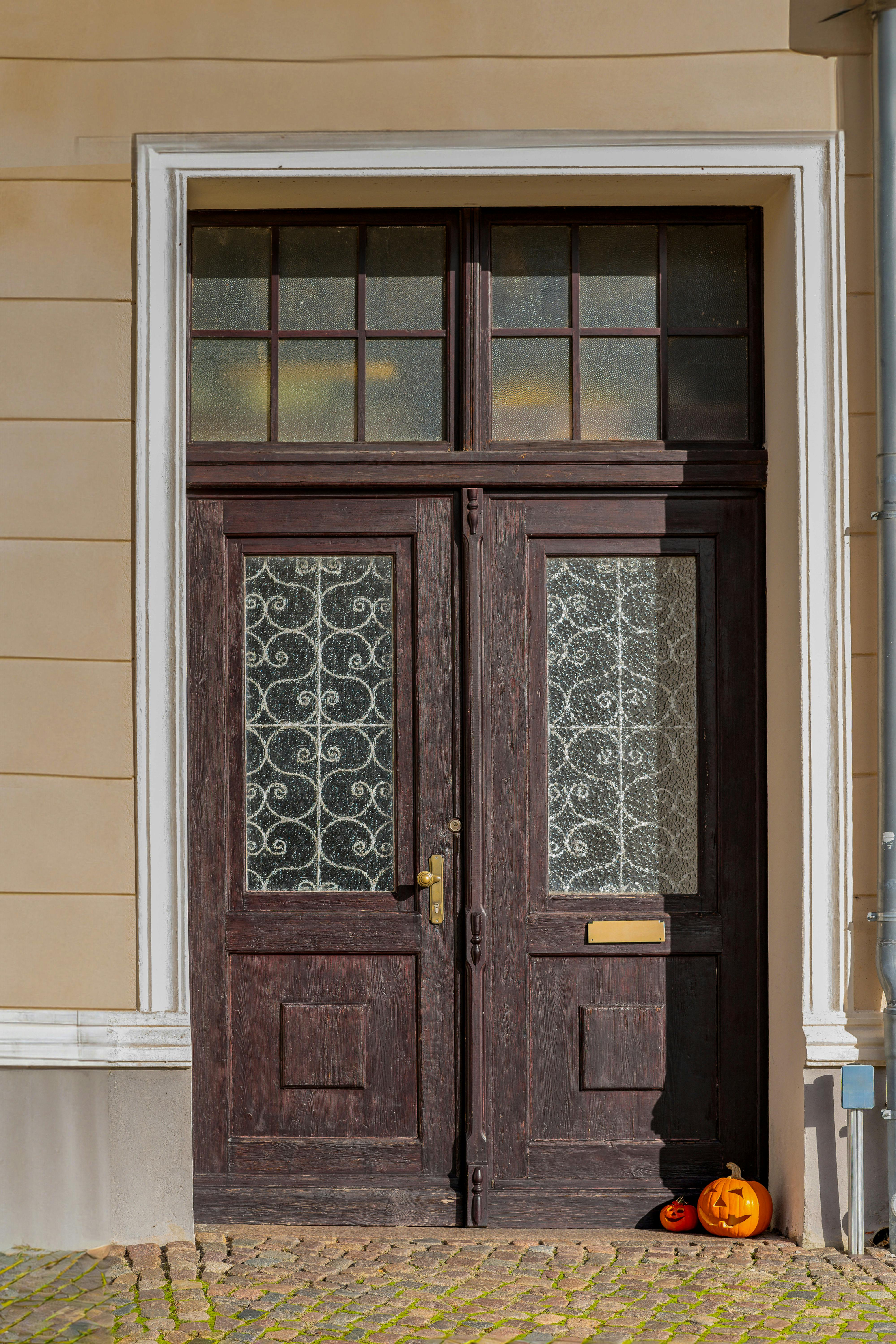 historic doorway with halloween pumpkins