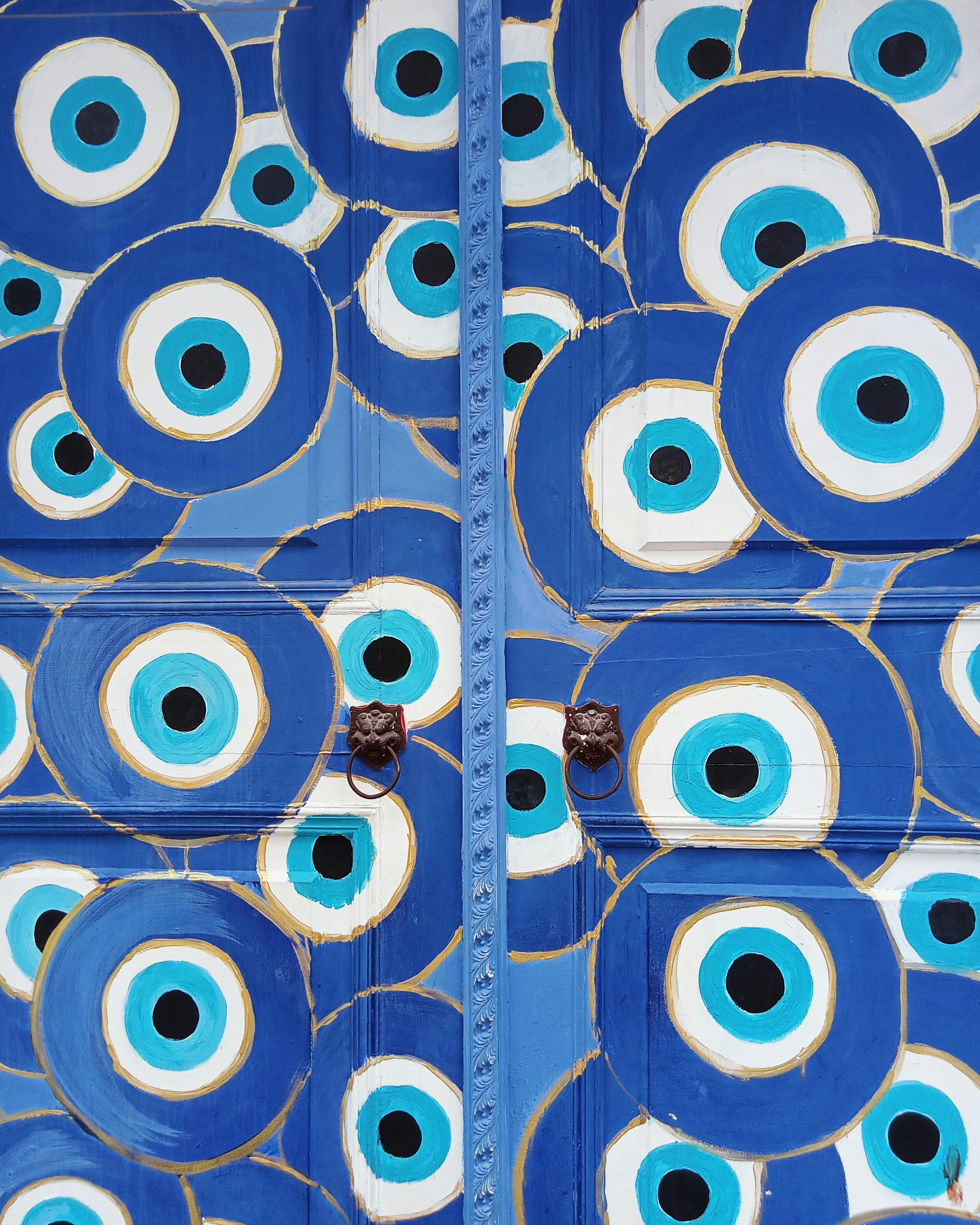 Colorful blue door featuring traditional evil eye design in Istanbul, Turkey.
