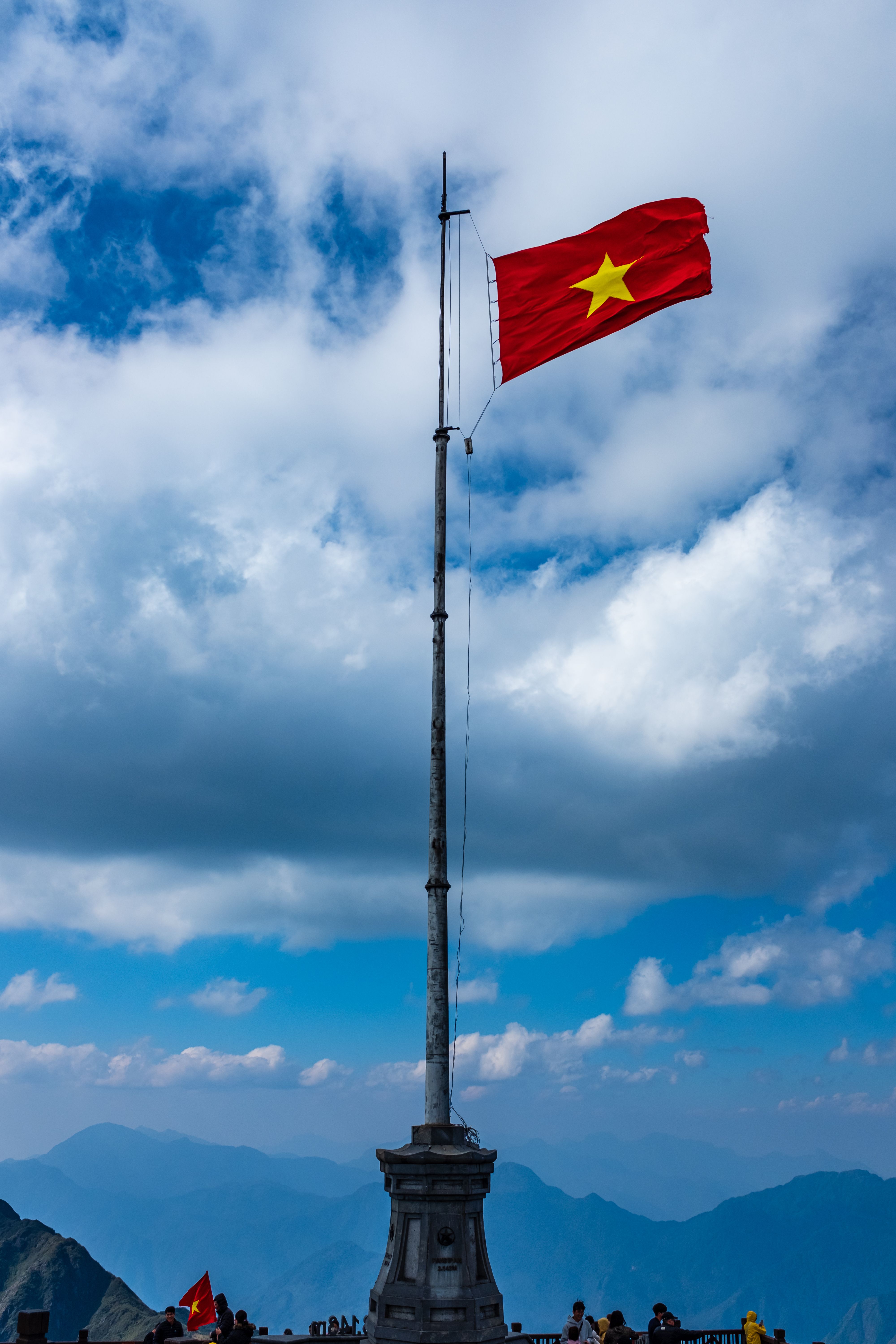 Vietnamese Flag Waving Over Ho Chi Minh City · Free Stock Photo