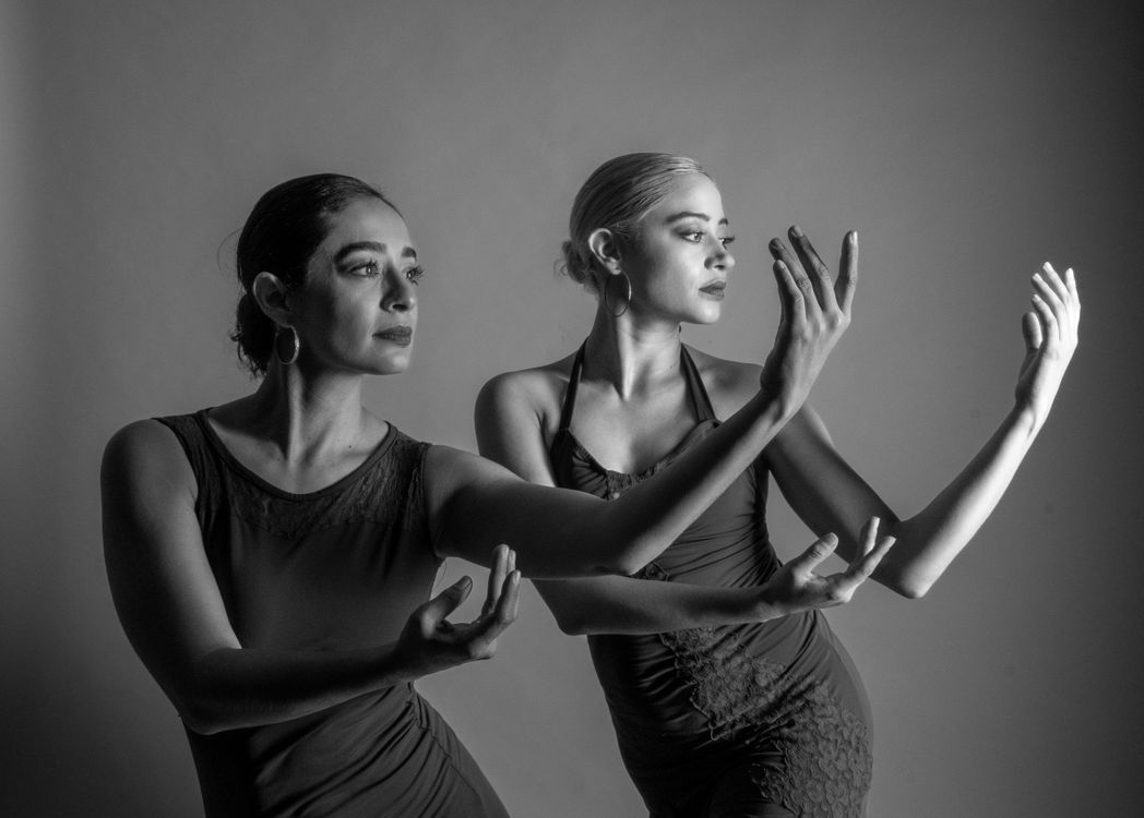 Elegant Duo Performing Expressive Dance Routine · Free Stock Photo