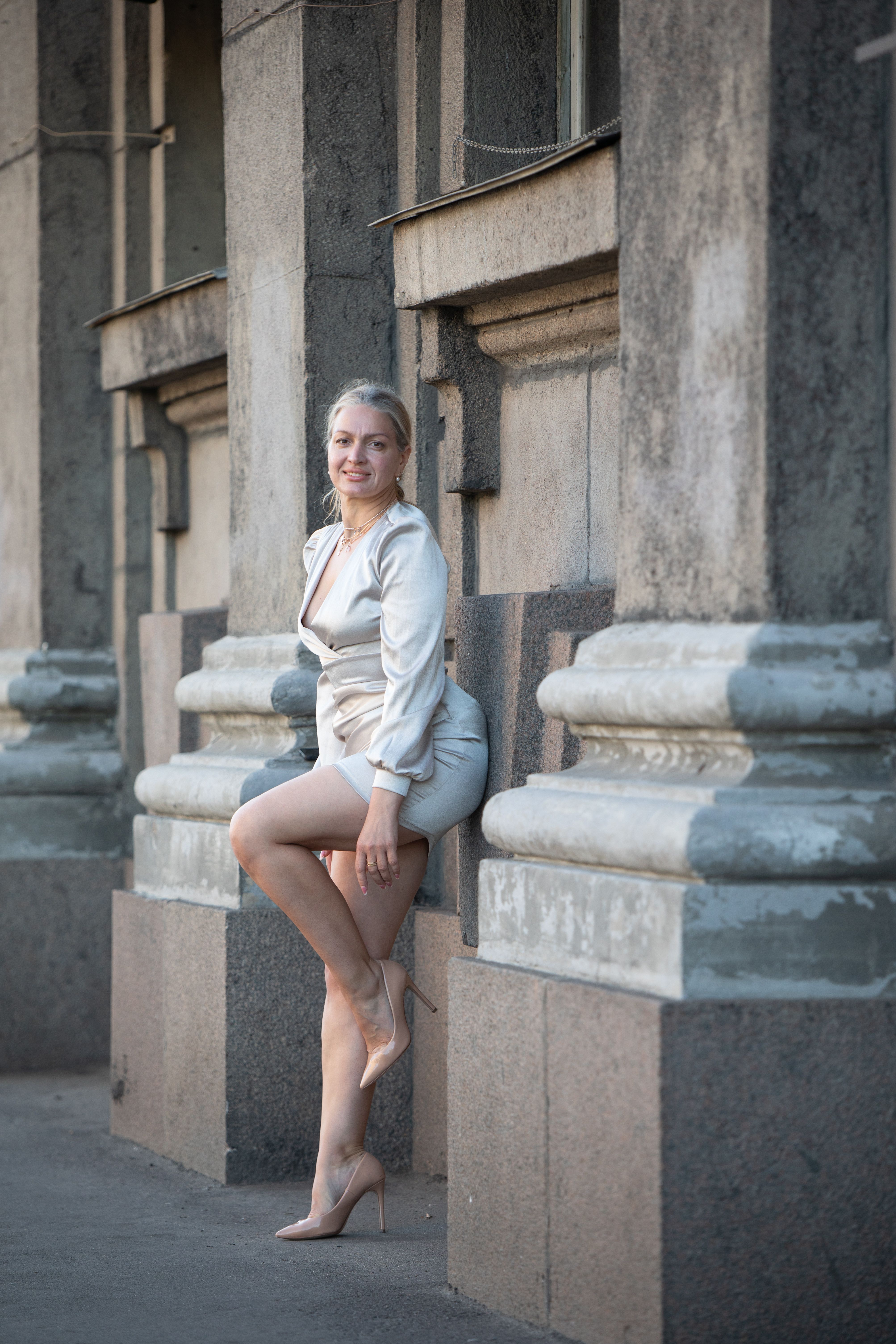 Elegant Woman Posing in Urban Architecture · Free Stock Photo
