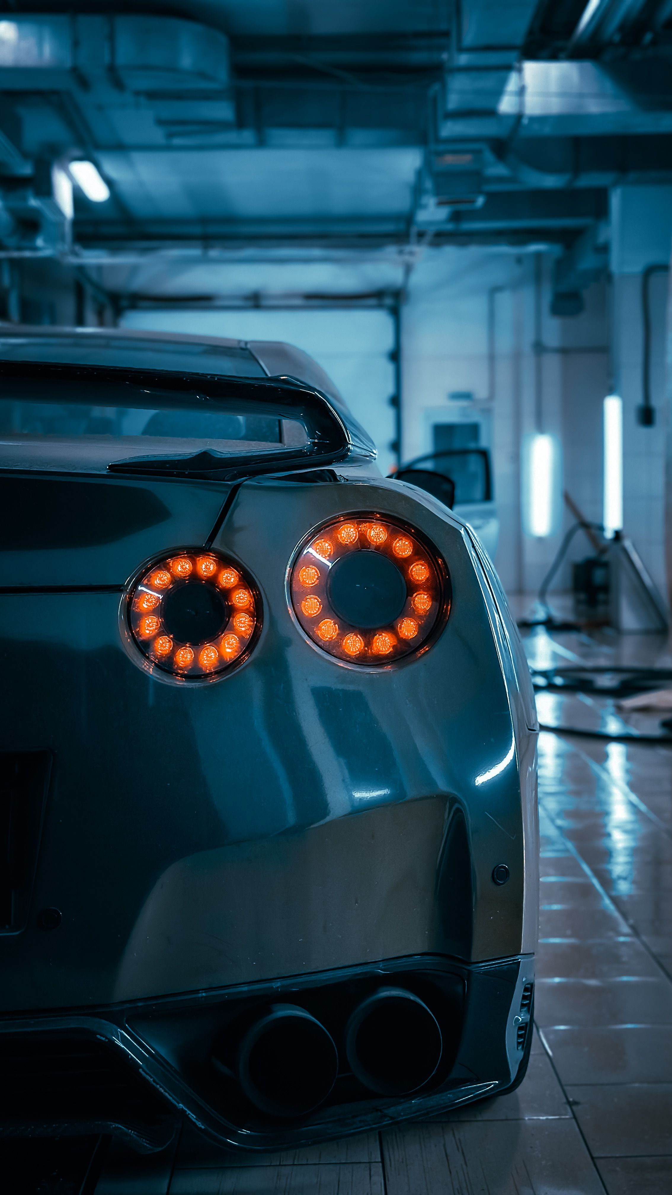 Sleek Sports Car In Modern Garage Setting Free Stock Photo