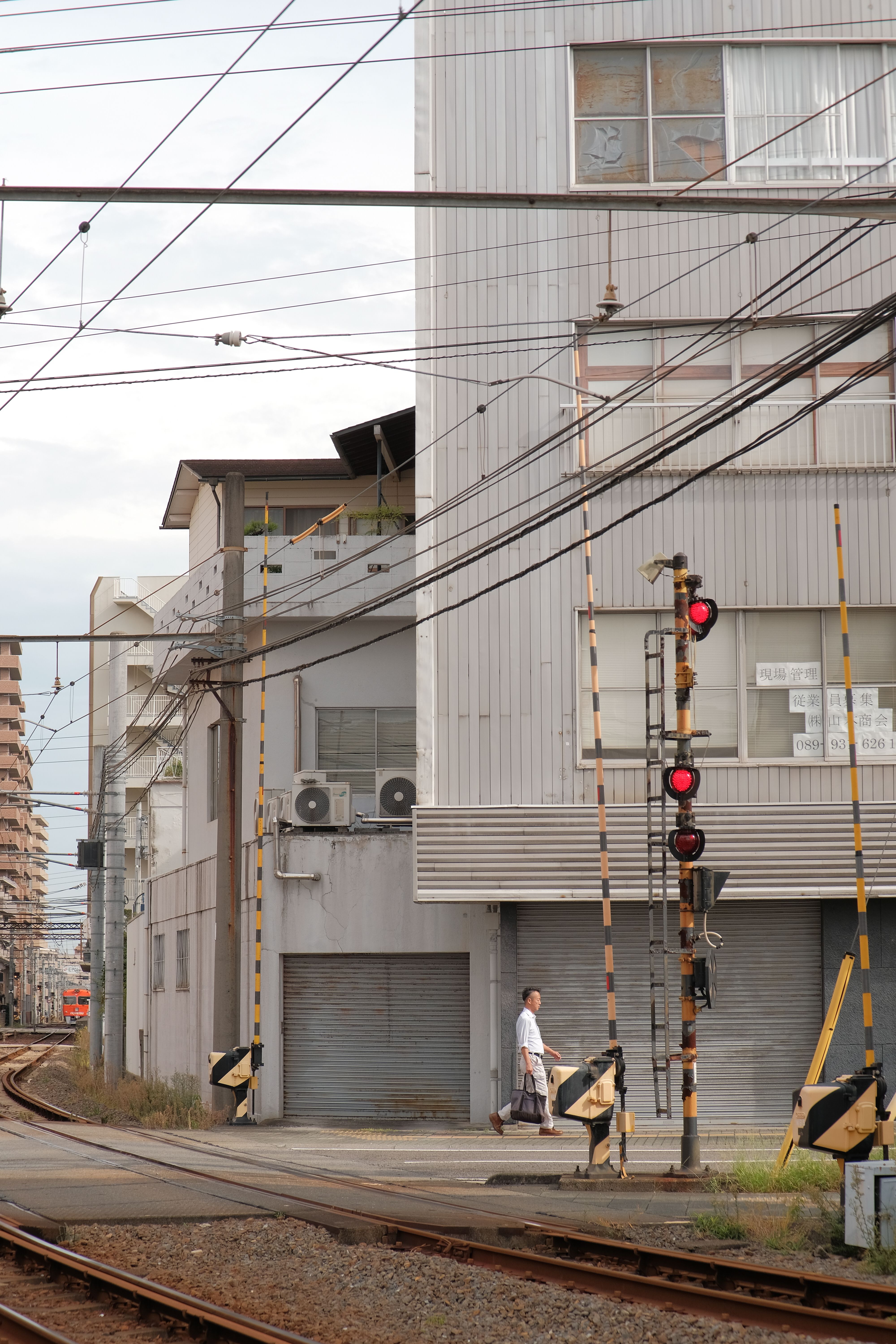 Urban Rail Crossing with Modern Architecture · Free Stock Photo
