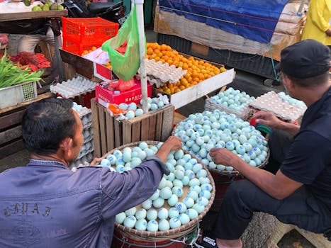 A vibrant scene at a traditional market in West Java, Indonesia showcasing duck eggs.