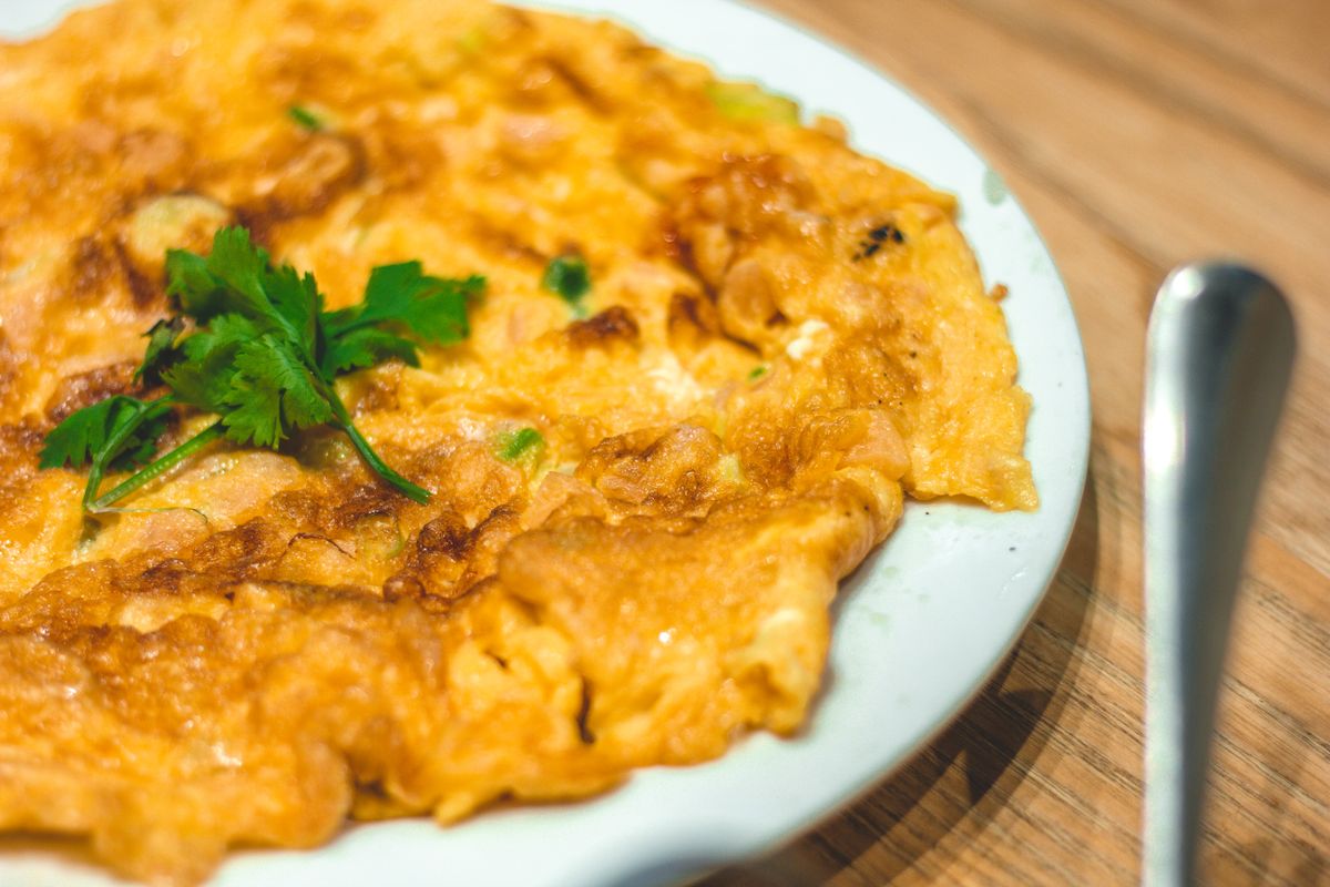 Taiwanese oyster omelet garnished with cilantro, a Shilin Night Market classic dish