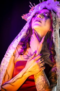 Mysterious woman with red dress and white veil in eerie light, creating a spooky Halloween vibe.