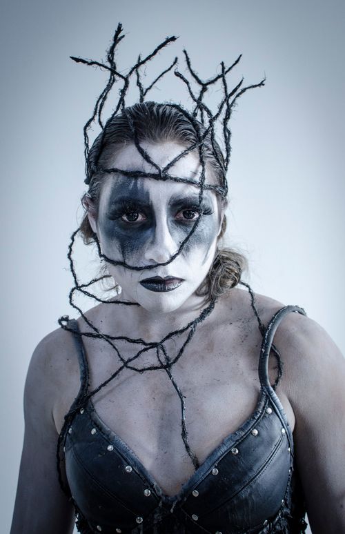 Free Artistic portrait with dark body paint, evoking a spooky and mysterious atmosphere. Stock Photo