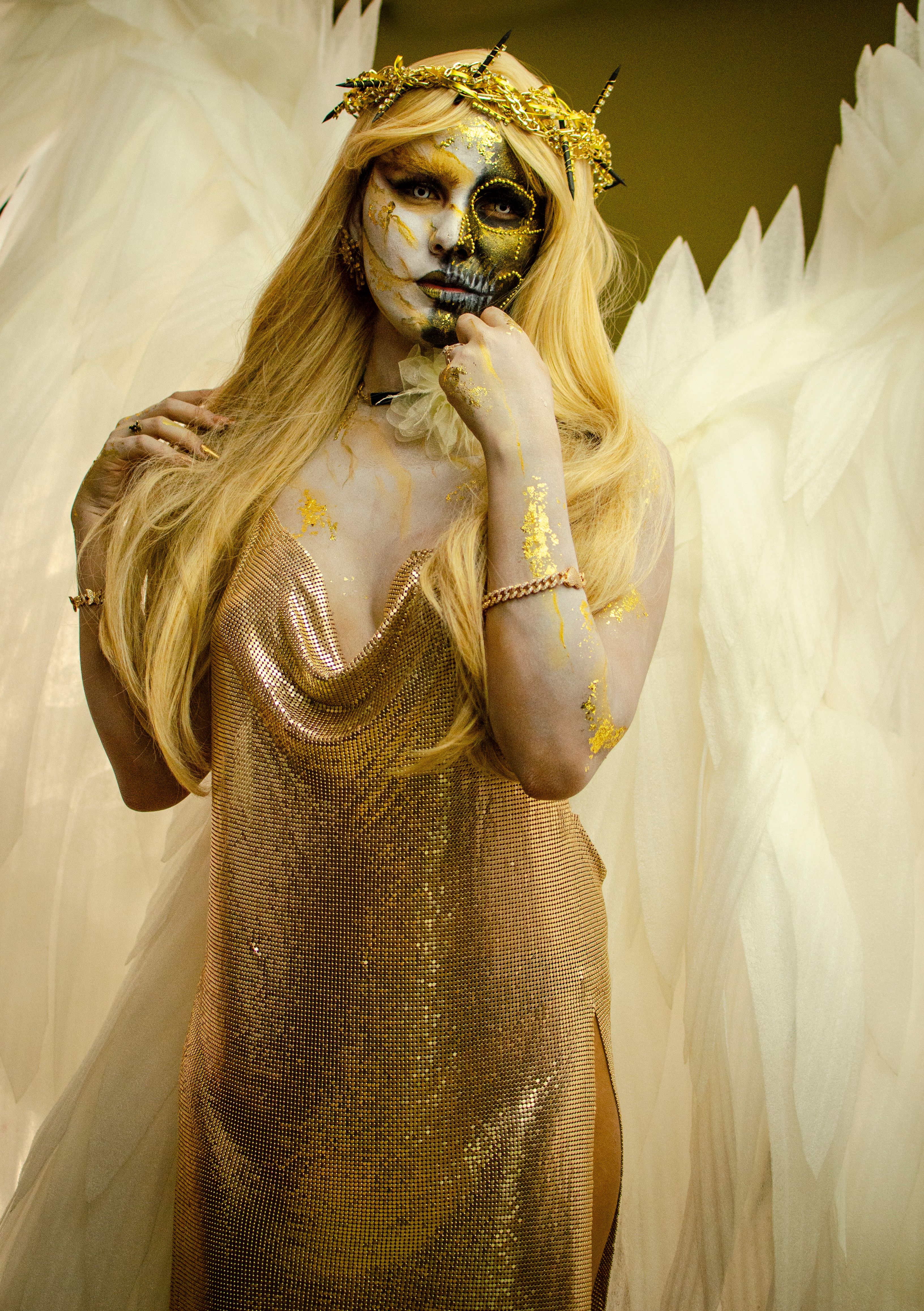 Gold-Clad Angelic Figure with Skull Makeup  Free Stock Photo