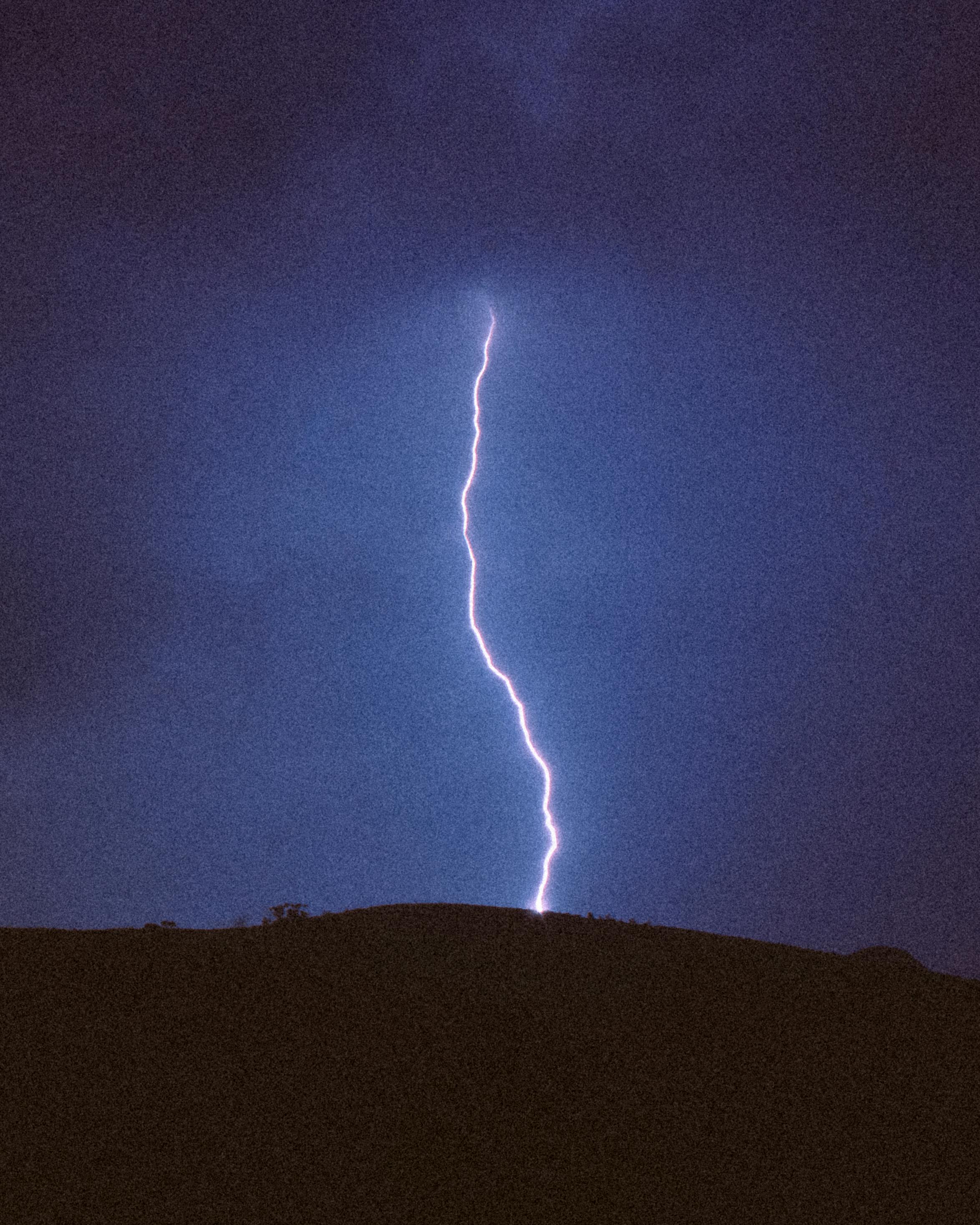 dramatic lightning bolt in night sky