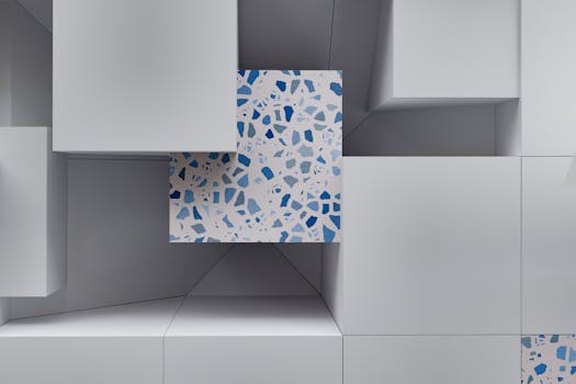 A modern abstract depiction of 3D cubes with a terrazzo pattern featuring blue accents.