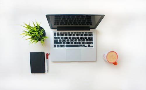 Free stock photo of book, coffee cup, laptop