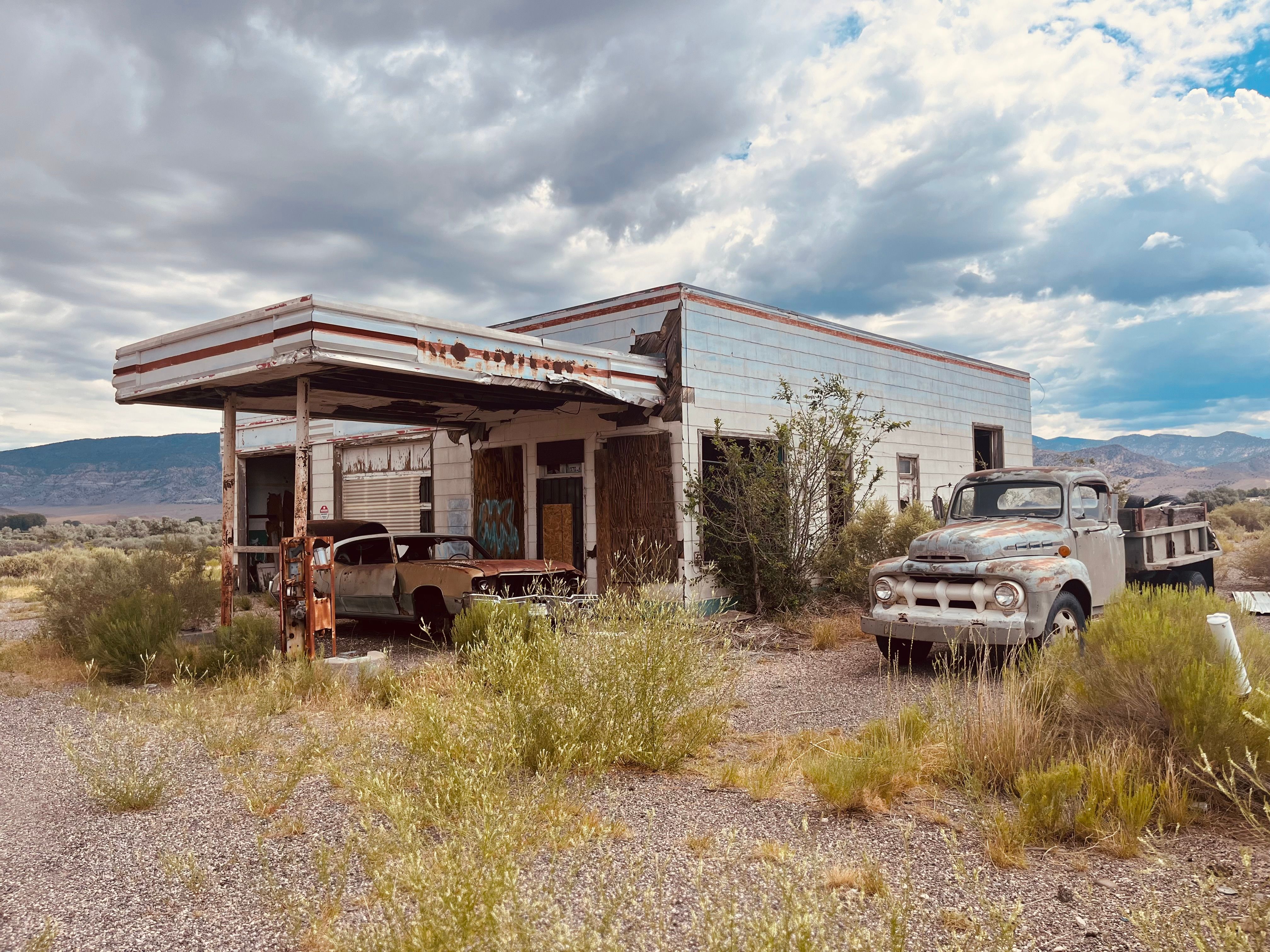 Abandoned Gas Station with Vintage Cars · Free Stock Photo