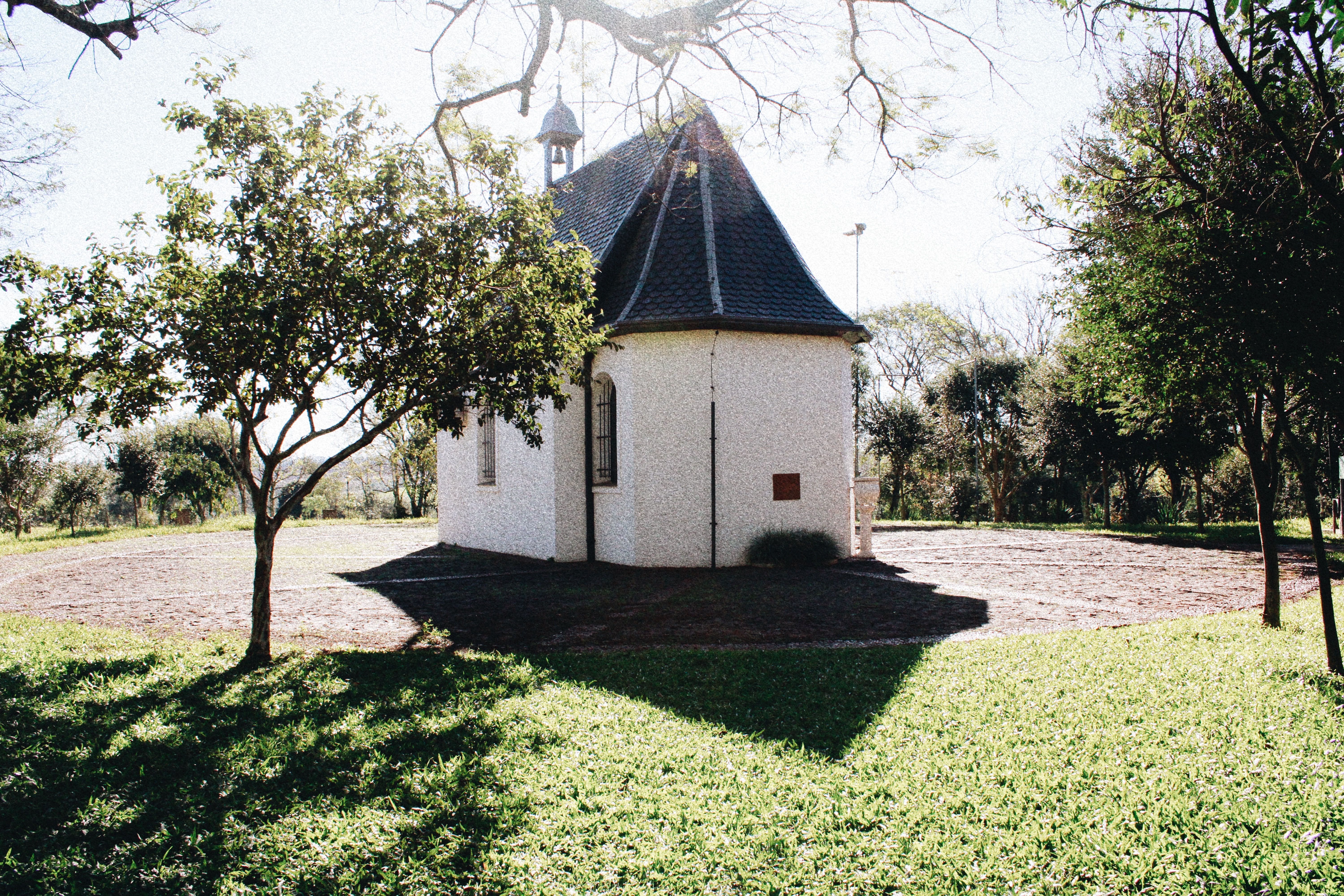 Charming Small Chapel Surrounded by Trees · Free Stock Photo