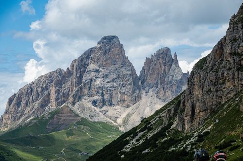 Free Breathtaking view of the Dolomites with lush greenery and rugged peaks under a vibrant sky. Stock Photo
