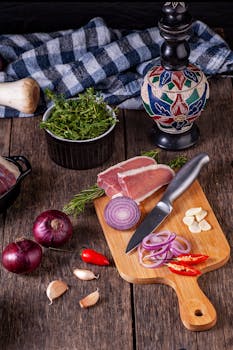 A rustic kitchen scene with fresh ingredients on a wooden board.