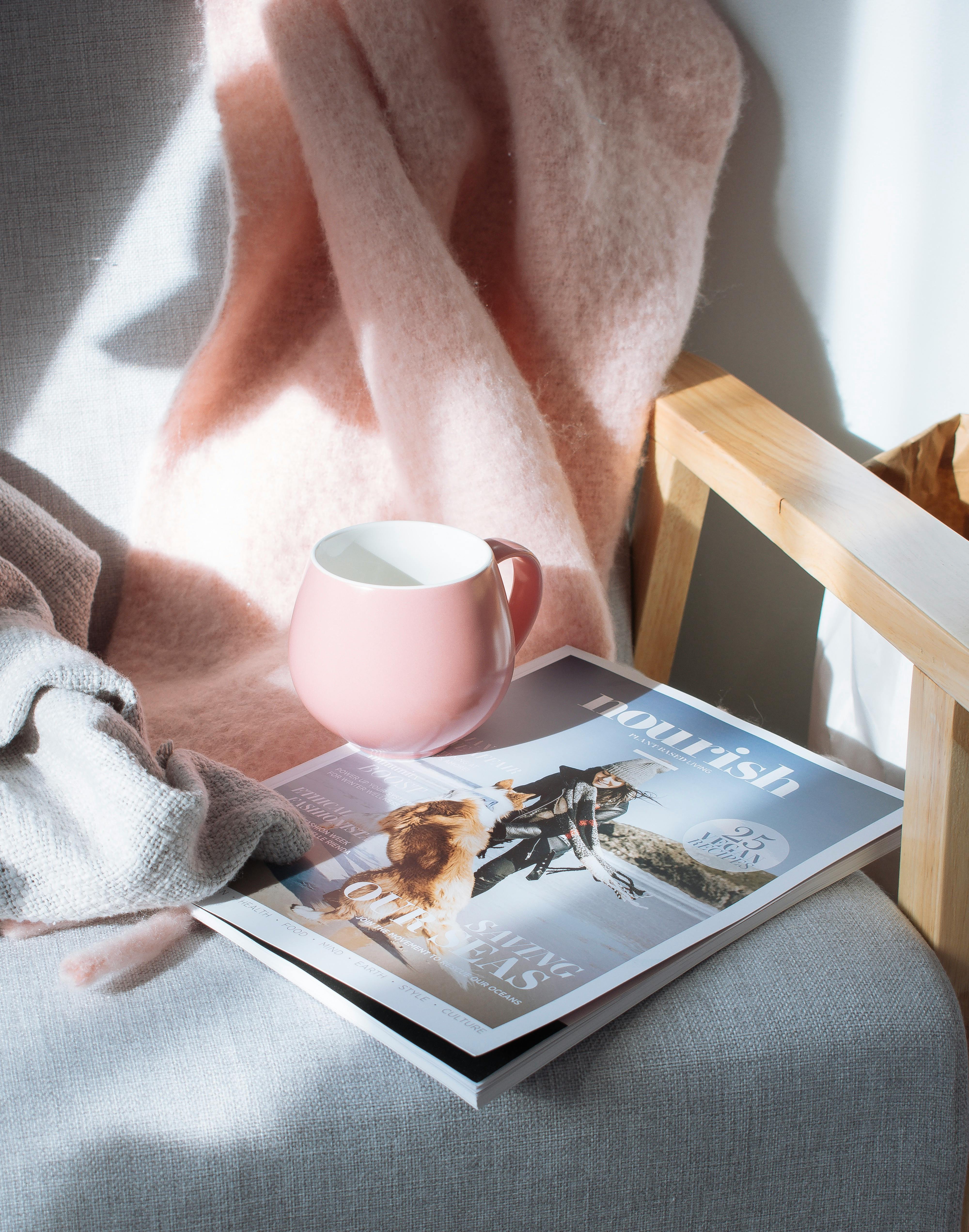 pink mug and magazine