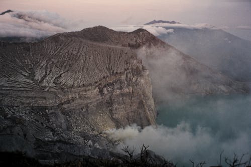 Aerial Photography of Gray Mountain With Smokes during Golden Hour