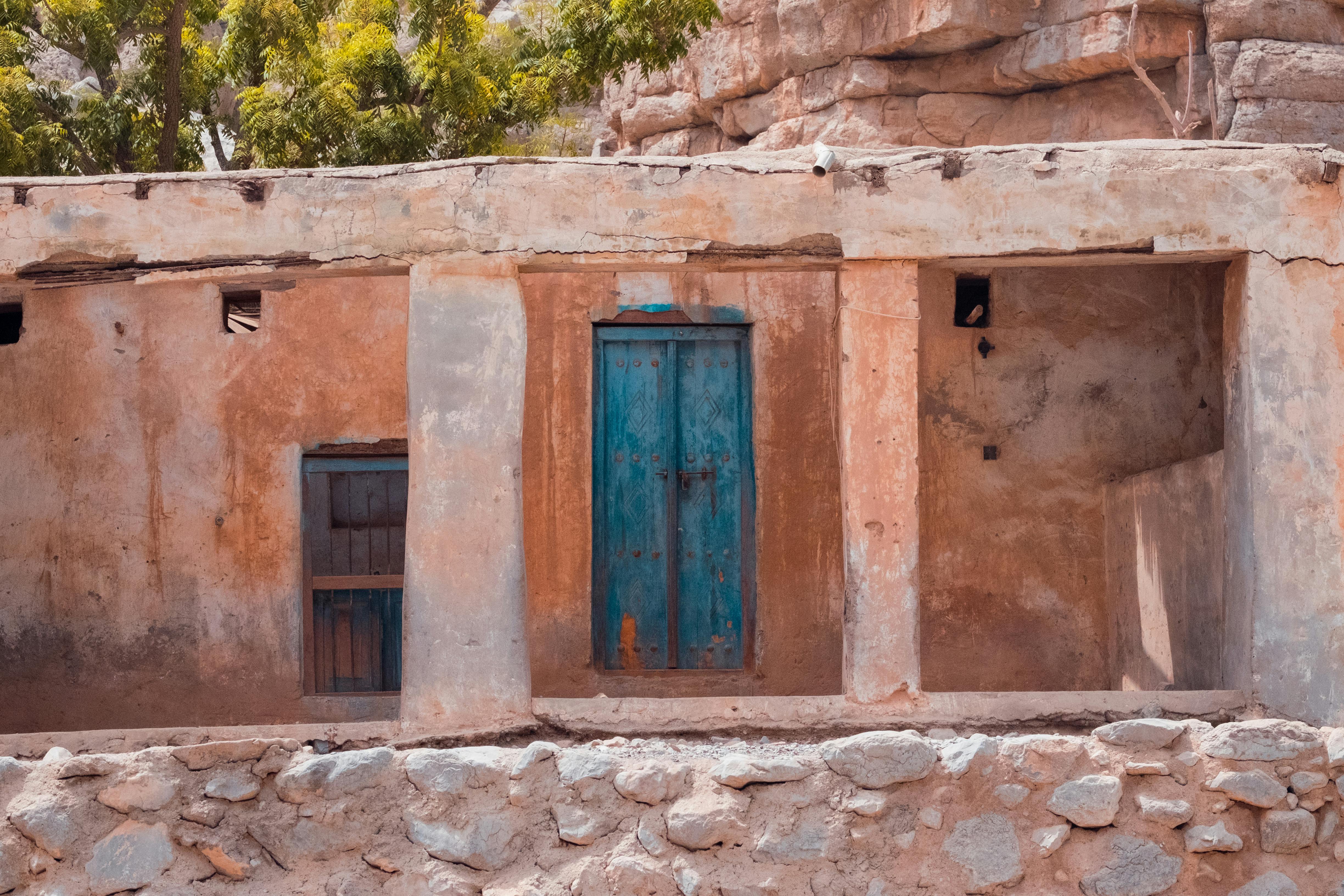 Old Adobe House with Weathered Blue Door