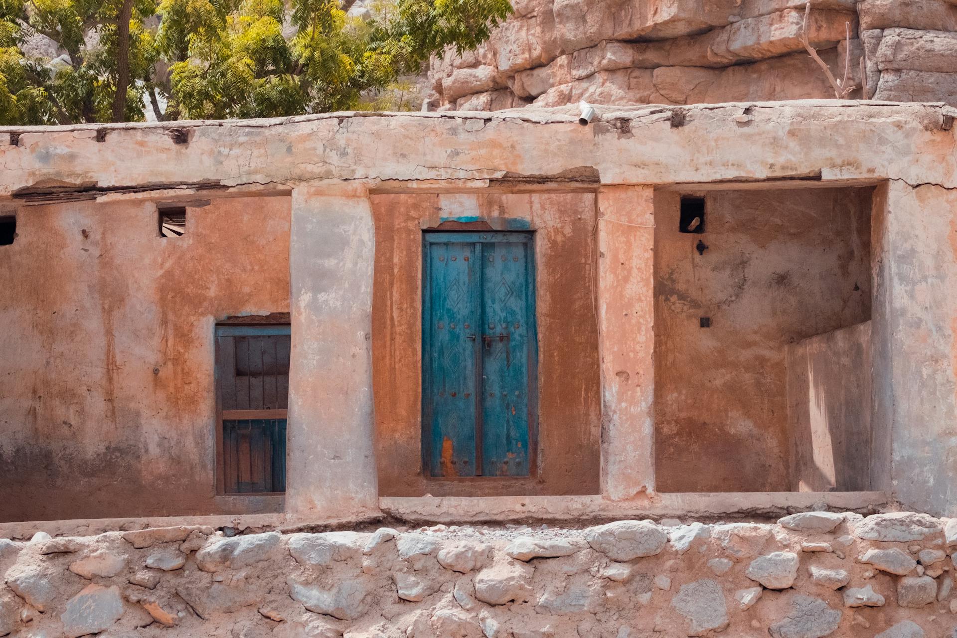 Old Adobe House with Weathered Blue Door