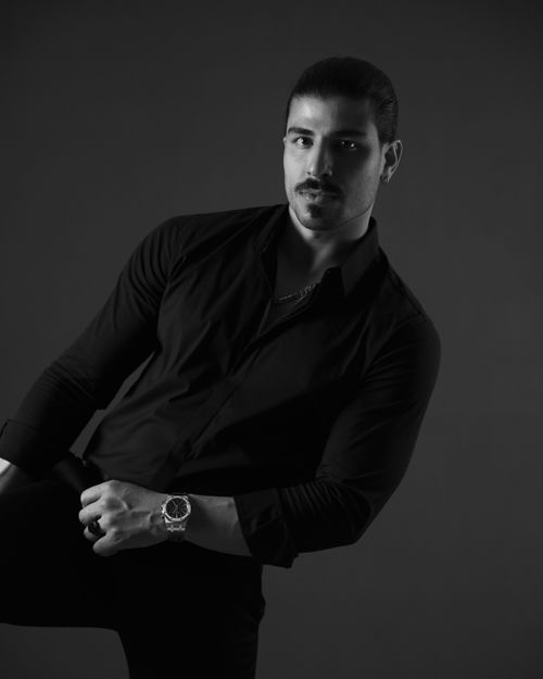Free Sophisticated black and white portrait of a man in a dark shirt. Stock Photo