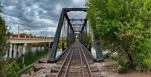 Free Iron railway bridge with scenic view, Dover, OH on a cloudy day. Stock Photo