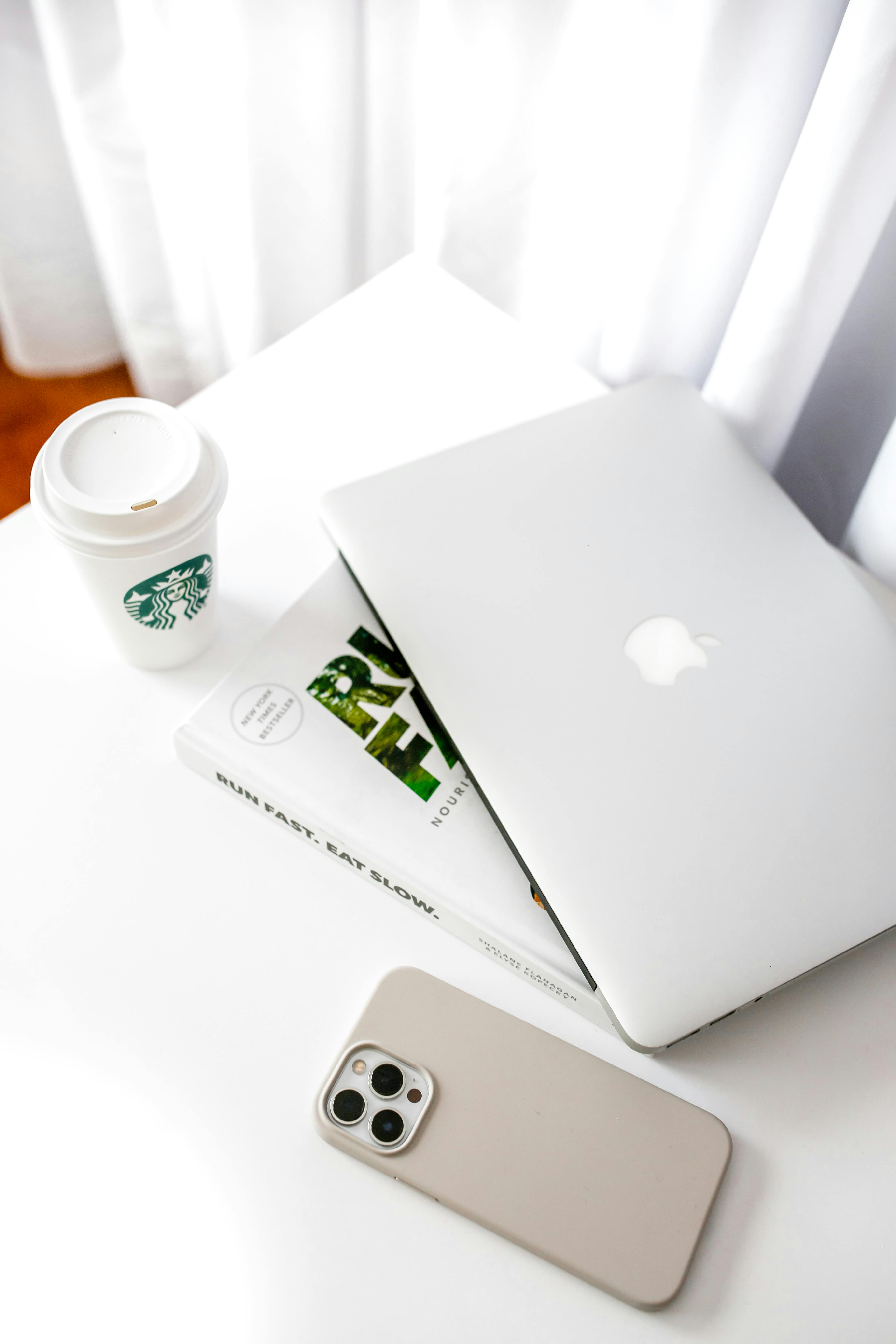 minimalist workspace with laptop and coffee cup