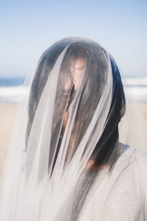 Woman Covered With White Veil
