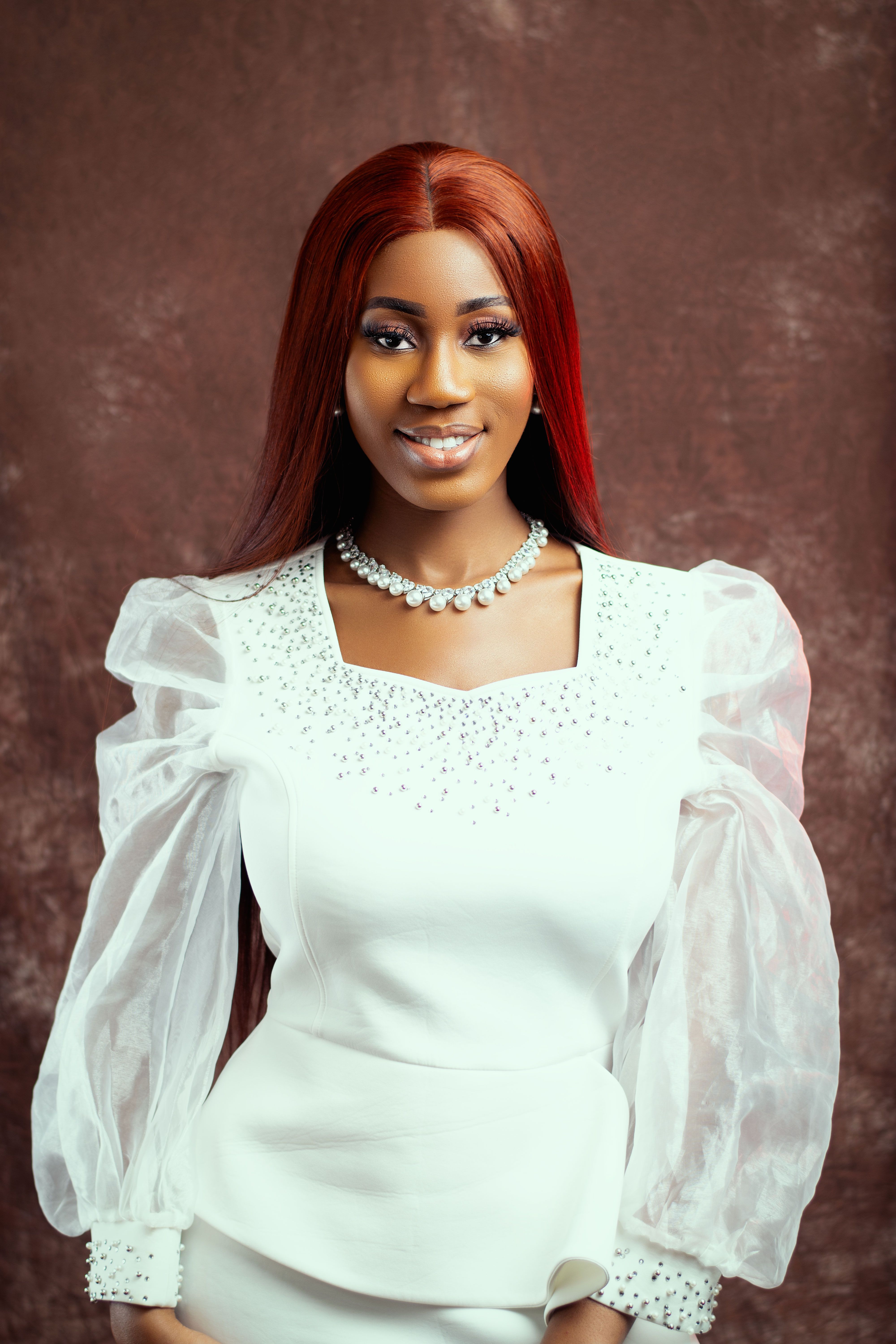 Beautiful bridal portrait featuring a woman in an elegant white gown with delicate accessories.