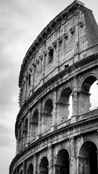 Black and white photo of Rome's Colosseum showcasing its majestic architecture.