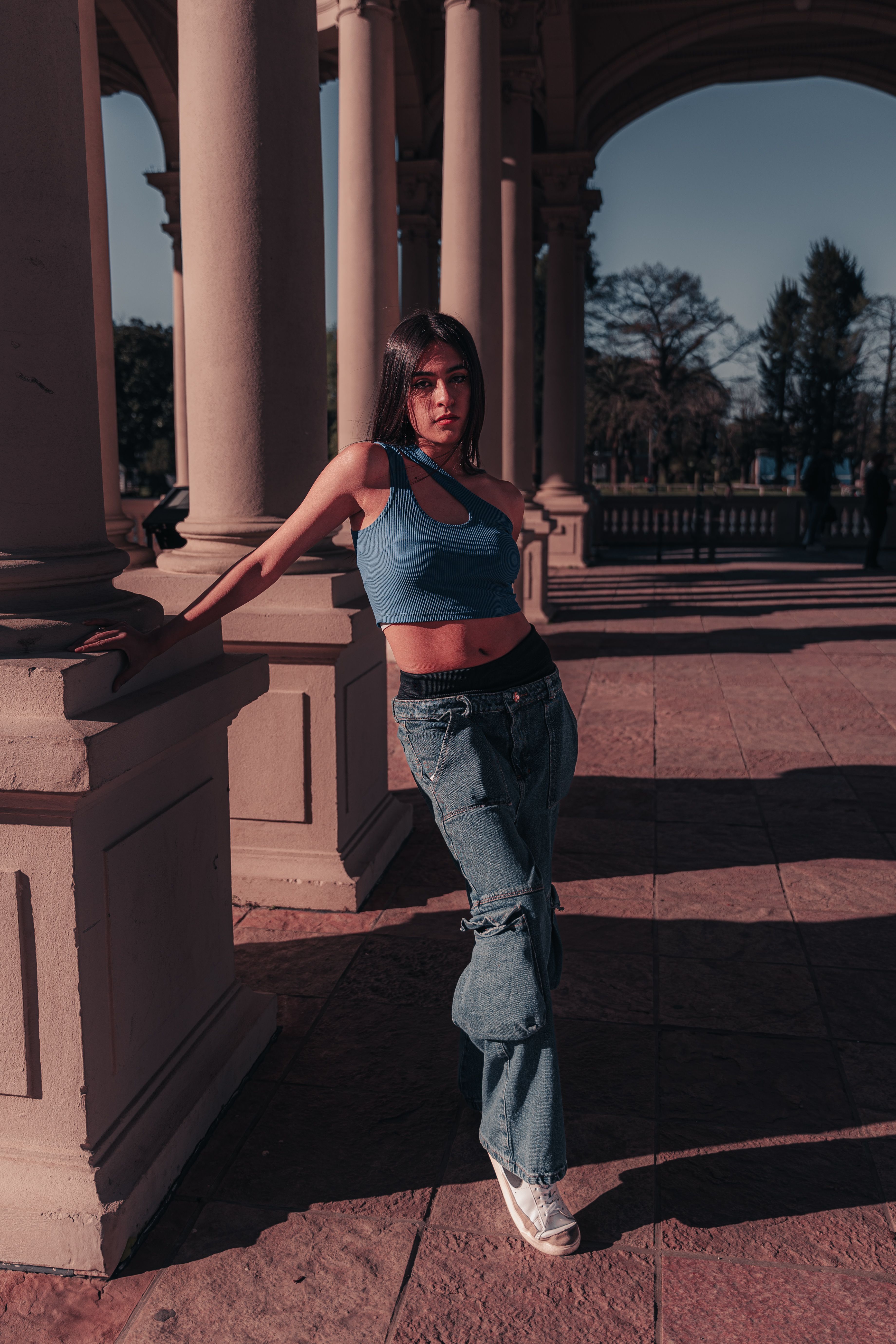 Stylish Young Woman Posing Outdoors in Urban Setting · Free Stock Photo