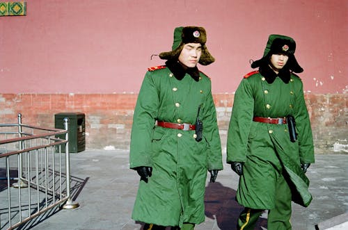 Men Wearing Green Coats