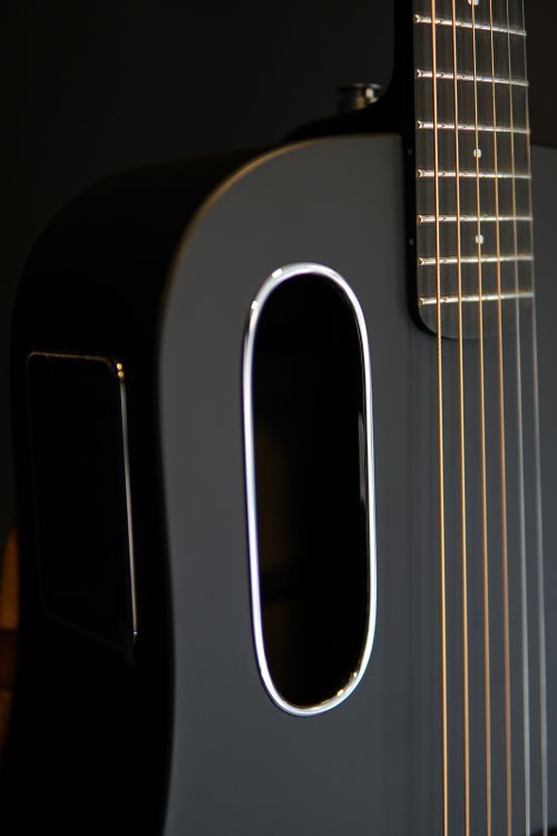 Close-up of a Modern Acoustic Guitar Body · Free Stock Photo