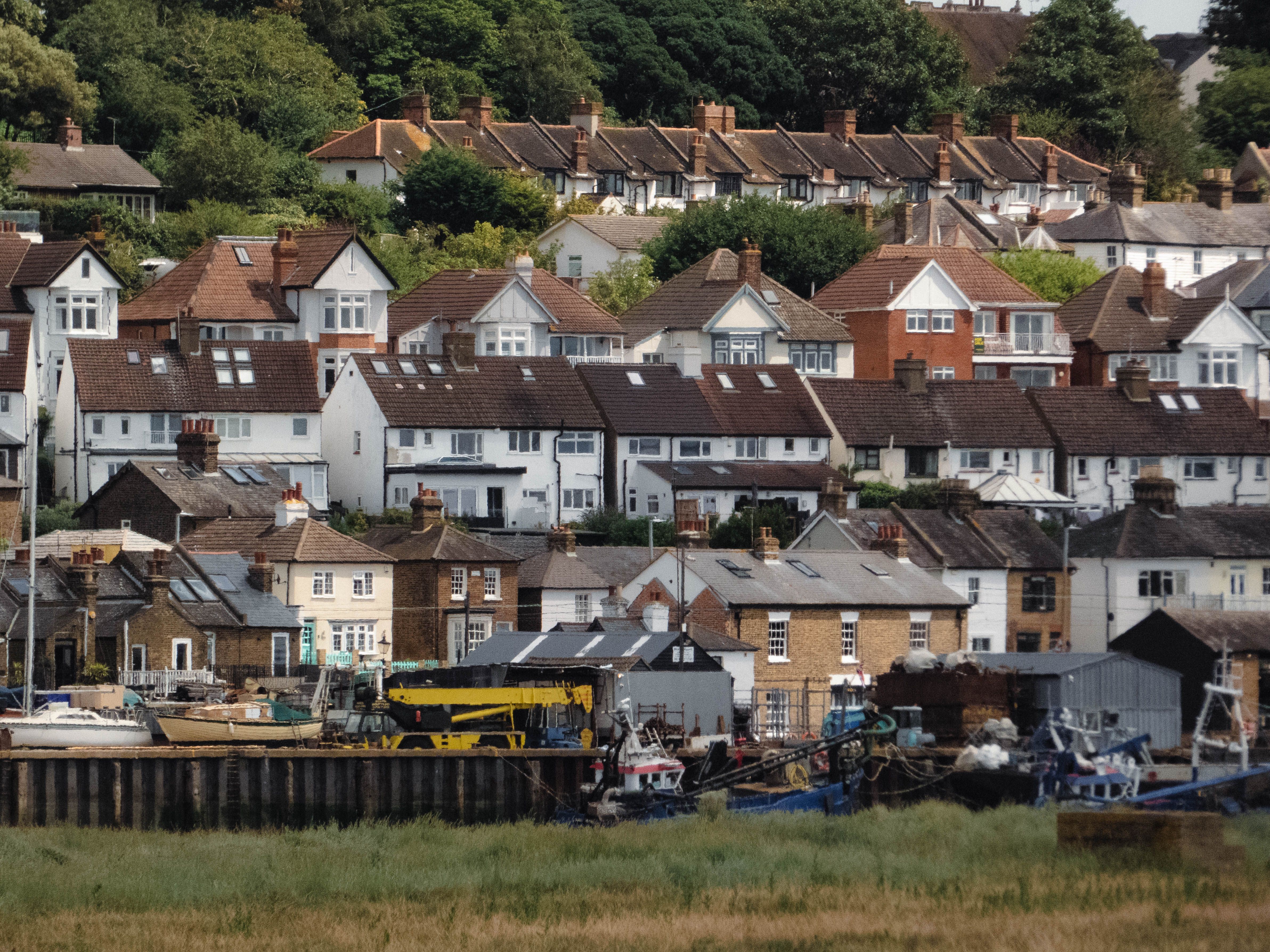 Picturesque coastal village featuring hillside homes and a serene maritime setting.