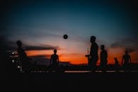 Silhouettes Playing Soccer at Sunset in Manaus