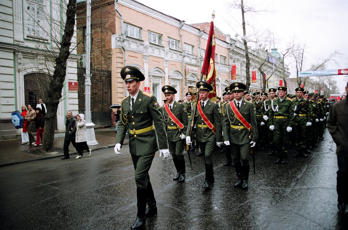 Military Personnel Parades on Road