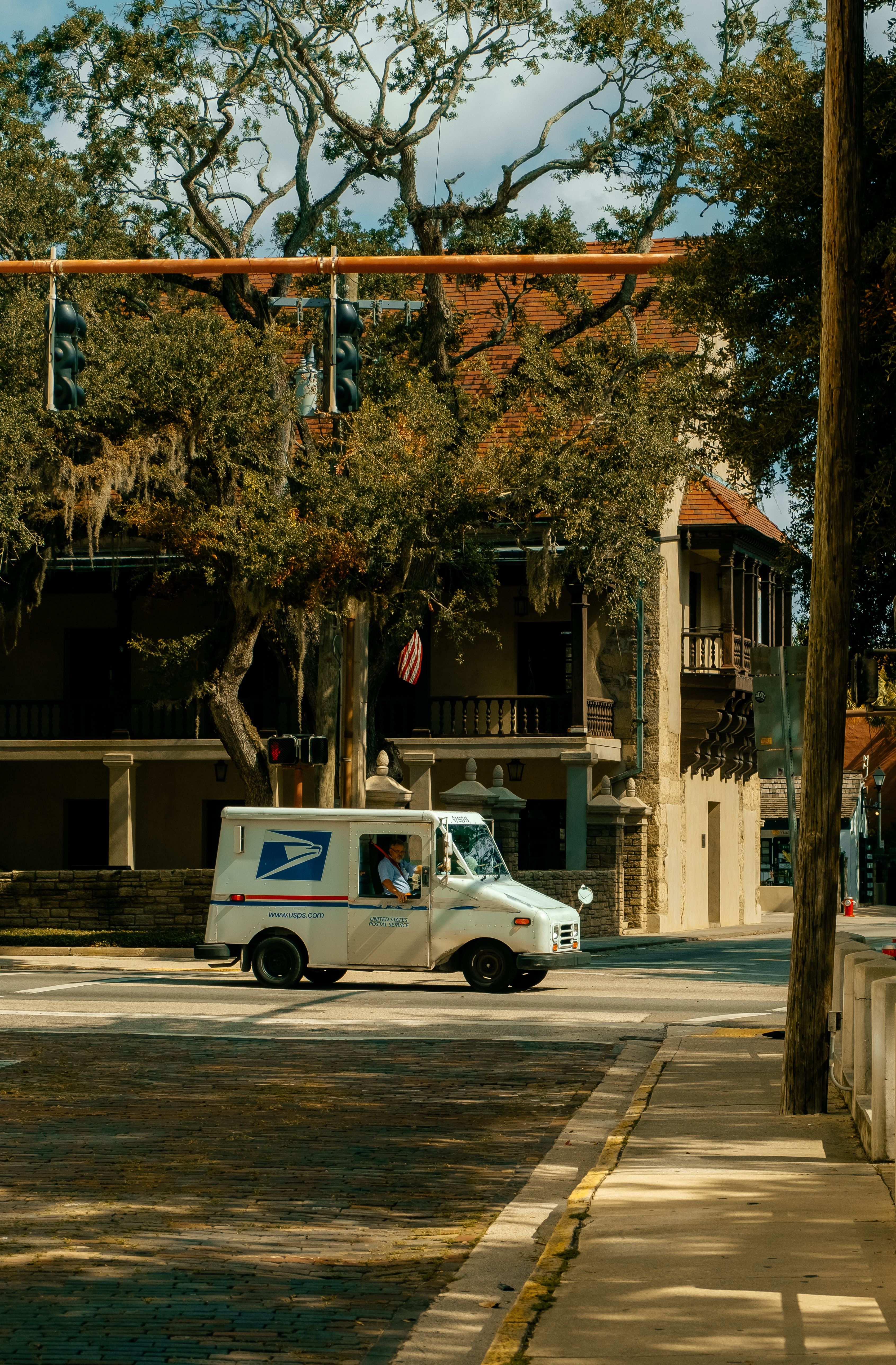 USPS mail truck on a residential street