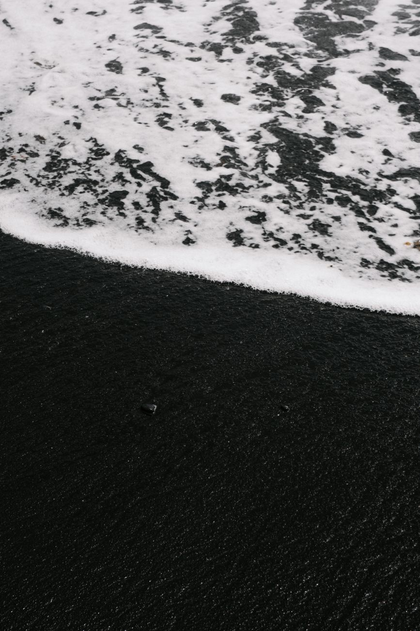 Captivating view of black sand beach being washed by ocean waves in Lanzarote, Spain.. pexels, captivating, view