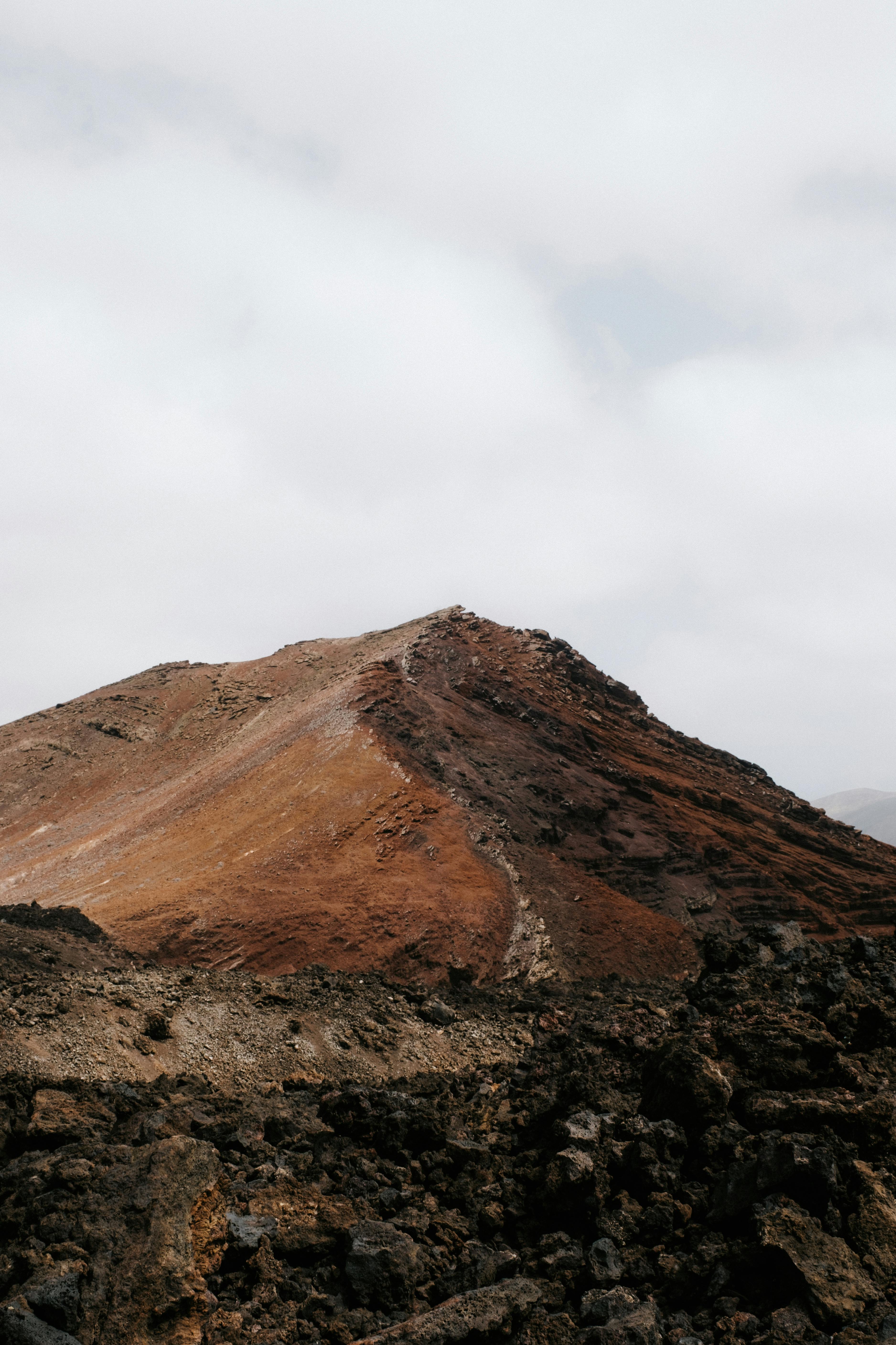 Explore the dramatic volcanic terrain in Lanzarote, Spain, showcasing rugged beauty.