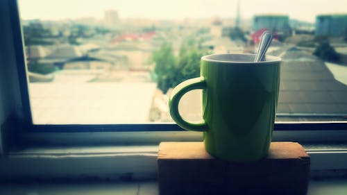 Free Silverware Utensil in Ceramic Mug on Brown Block Stock Photo