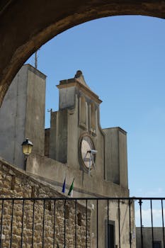Charming historical building in Naples with classical architecture under a clear blue sky.