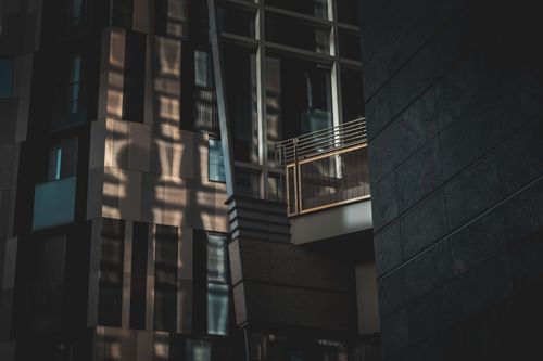 Free Dark moody shot of modern urban architecture with dramatic shadows. Stock Photo